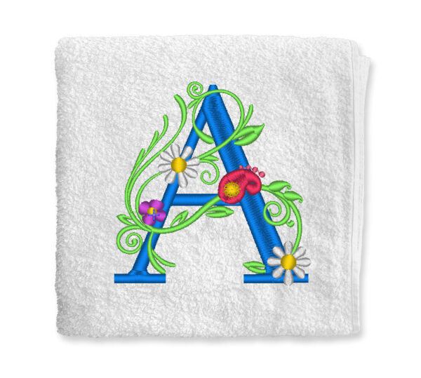 virágos hímzett monogrammos törölköző